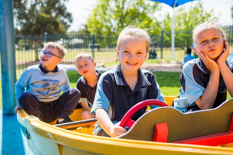 students enjoying the colourful play equipment.