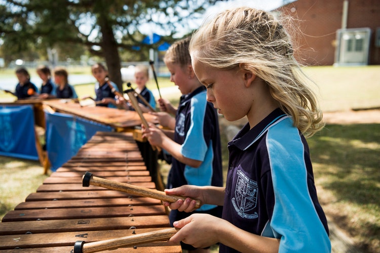 Students are performing on Marimbas.