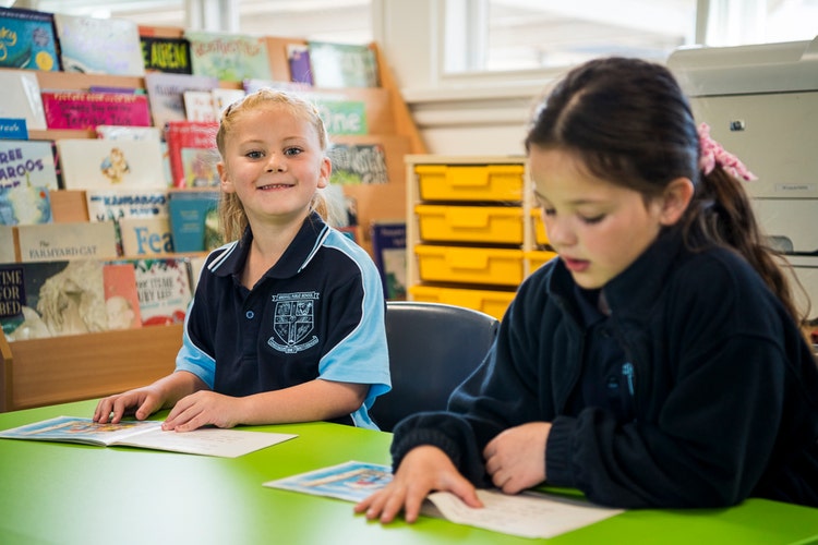 Two students happy during reading time.